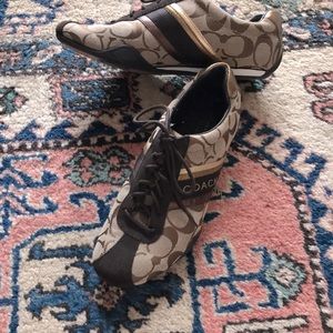 Stylish bronze tan iconic Coach print shoes.